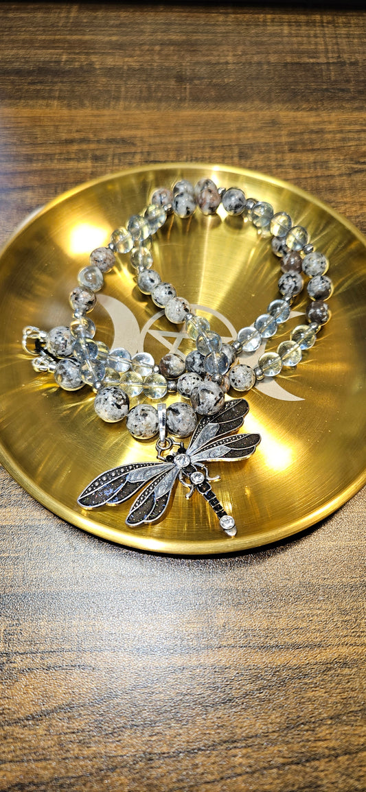Yooperlite & Blue Topaz Necklace with Black Dragonfly Pendant: Mysterious by day. Electric by night.