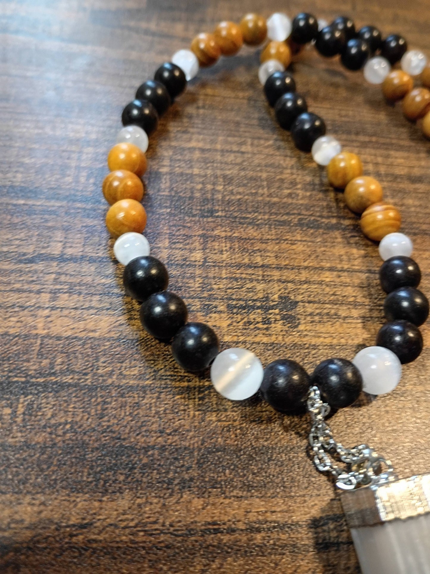 Handcrafted 24" necklace with Ebony Wood, Golden Sandalwood, and Selenite beads featuring a Satin Spar Selenite pendant.
