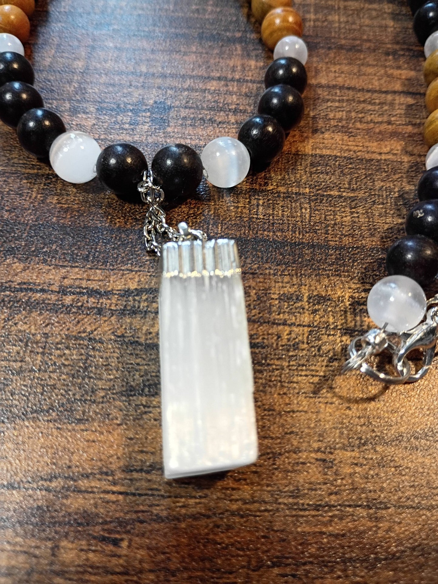 Handcrafted 24" necklace with Ebony Wood, Golden Sandalwood, and Selenite beads featuring a Satin Spar Selenite pendant.