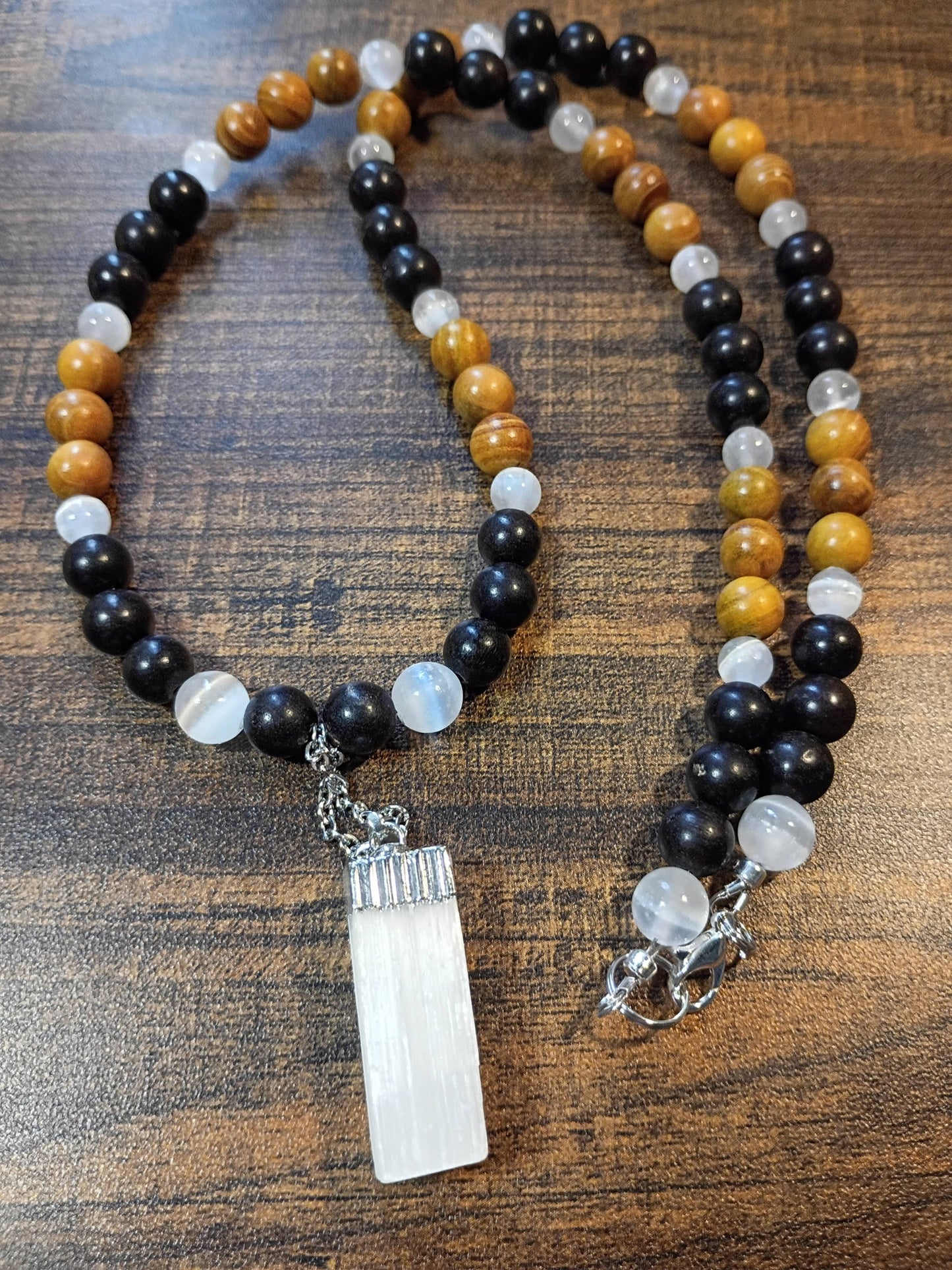 Handcrafted 24" necklace with Ebony Wood, Golden Sandalwood, and Selenite beads featuring a Satin Spar Selenite pendant.