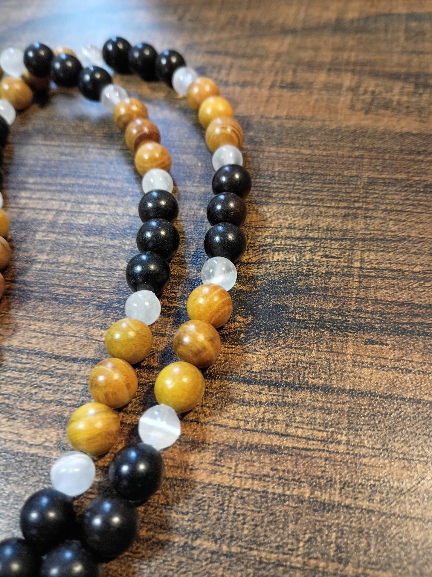 Handcrafted 24" necklace with Ebony Wood, Golden Sandalwood, and Selenite beads featuring a Satin Spar Selenite pendant.